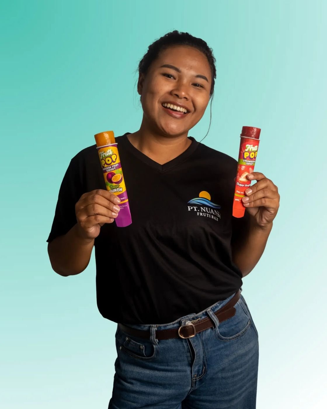 Fruti Pop team member holding two pops