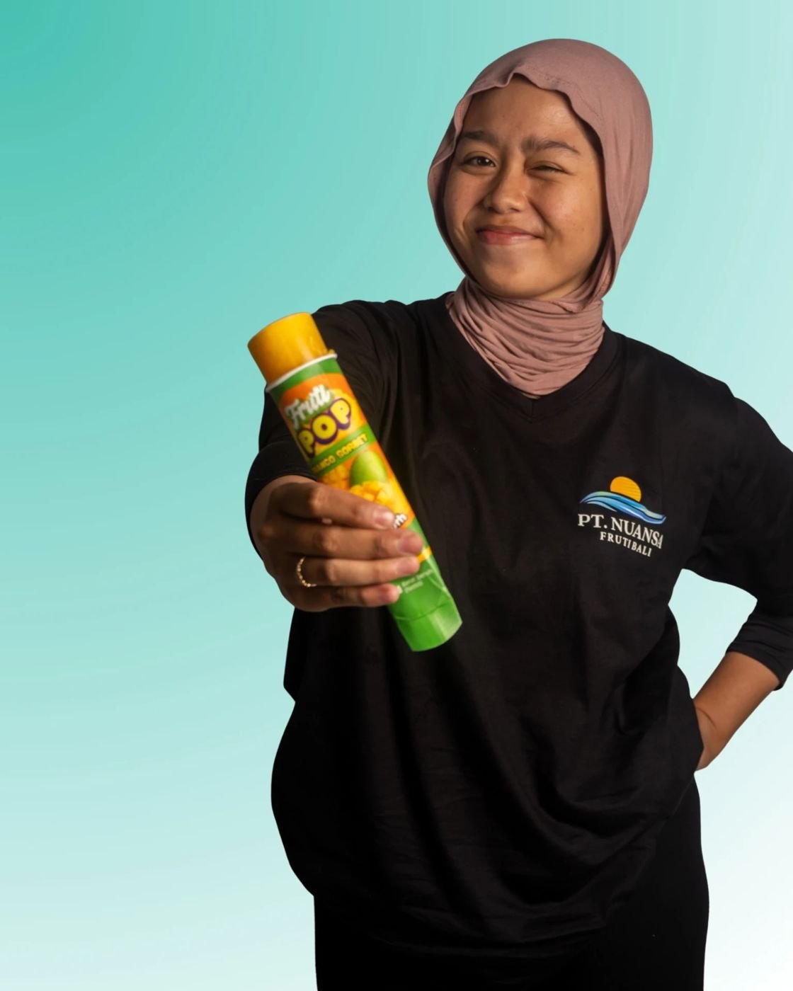 Fruti Pop team member holding a pop