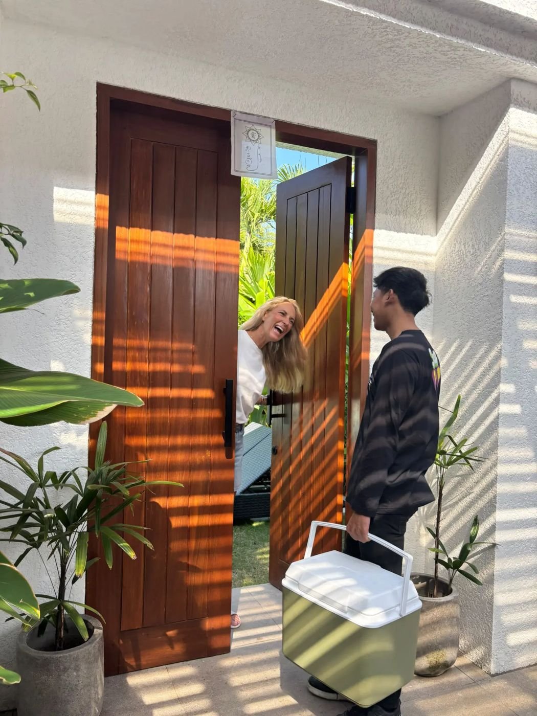 A Fruti Pop cooler being delivered to a villa door